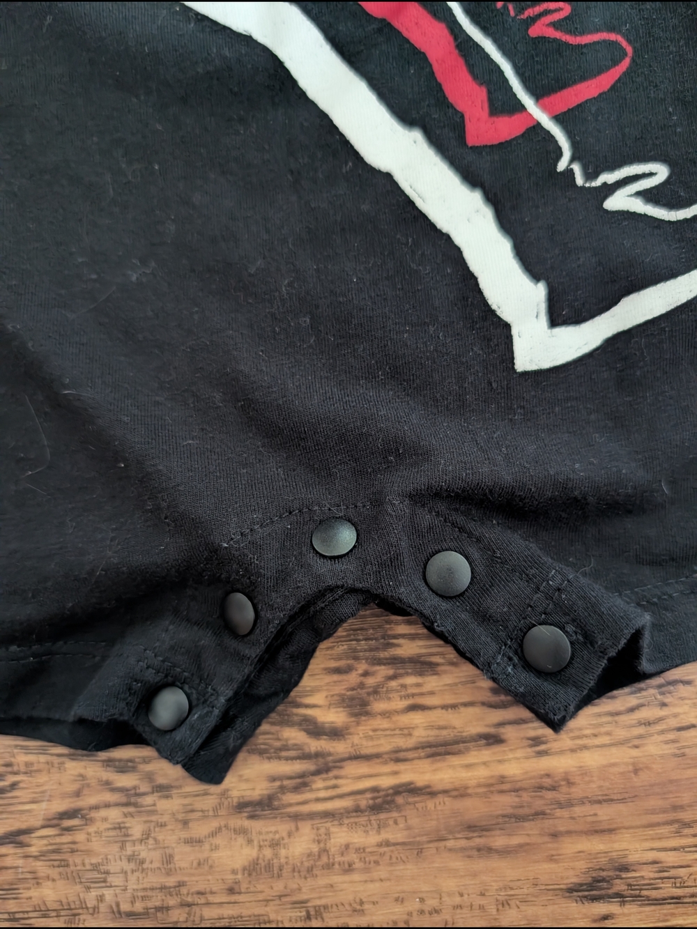 $ 💥3/$24 Jordan Baby Romper in Black with Red + White Jumpman Graphic - Picture 2 of 5